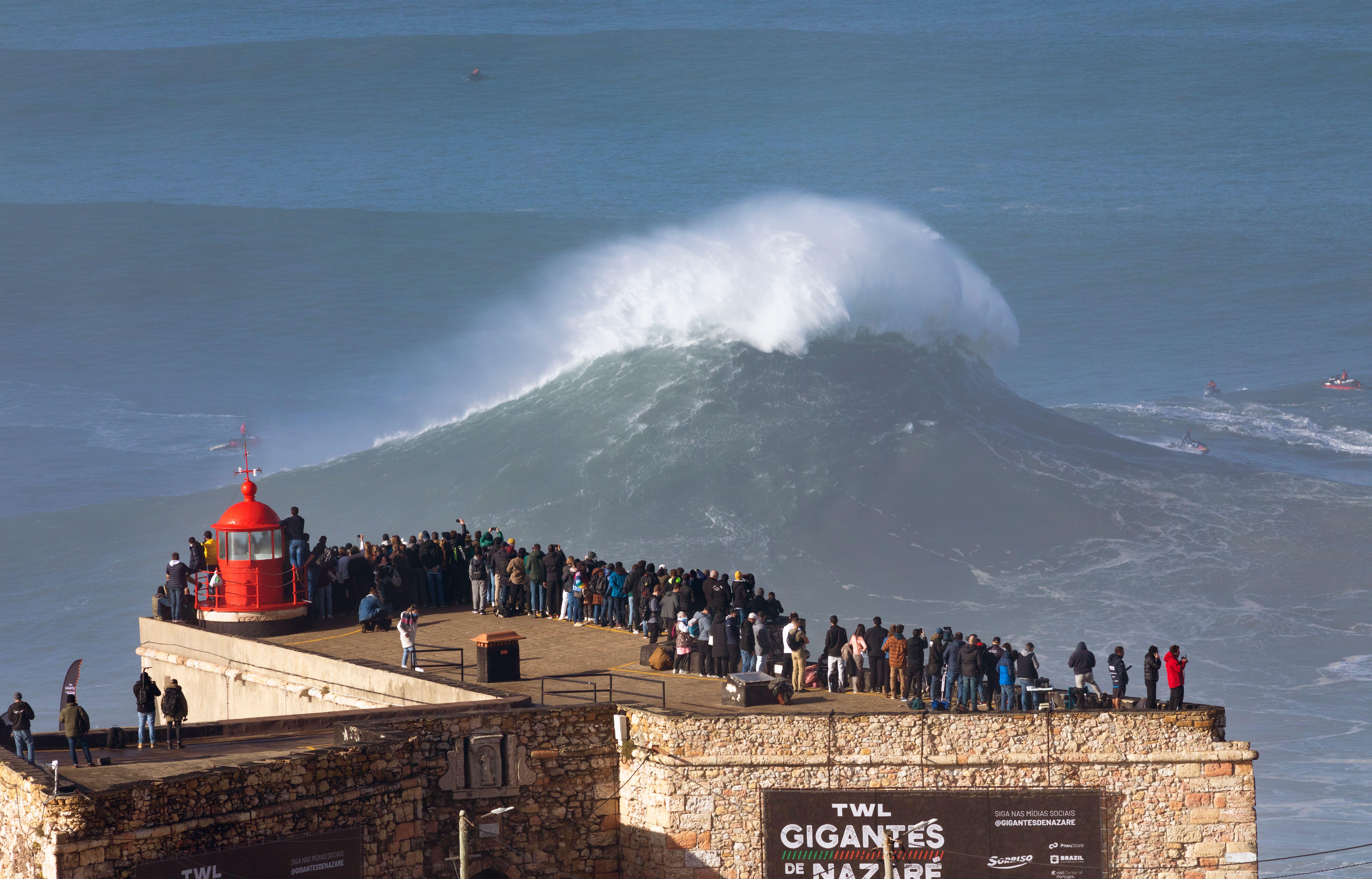 Europe, Portugal, Oeste Region, Nazaré, Crowd watching the Huge Waves from Forte de Sao Miguel Arcanjo during Free Surfing Event 2022