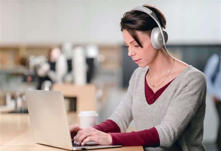 Photo of woman wearing the Bose UC headphones