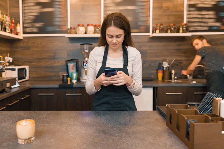 Picture of retail clerk using smartphone