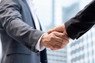 Business professional shaking hands