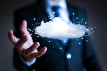 A business person with a cloud in hand