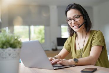 Photo showing contact center agent working from home