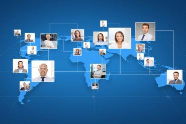 Picture of business colleagues over world map