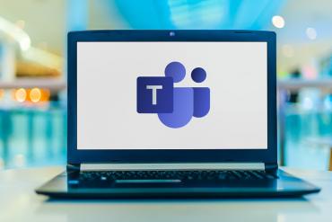 A laptop displaying a Microsoft Teams logo