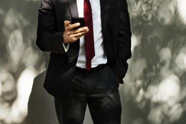 Business person looking at phone