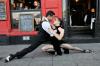 Two dancers tangoing in the street